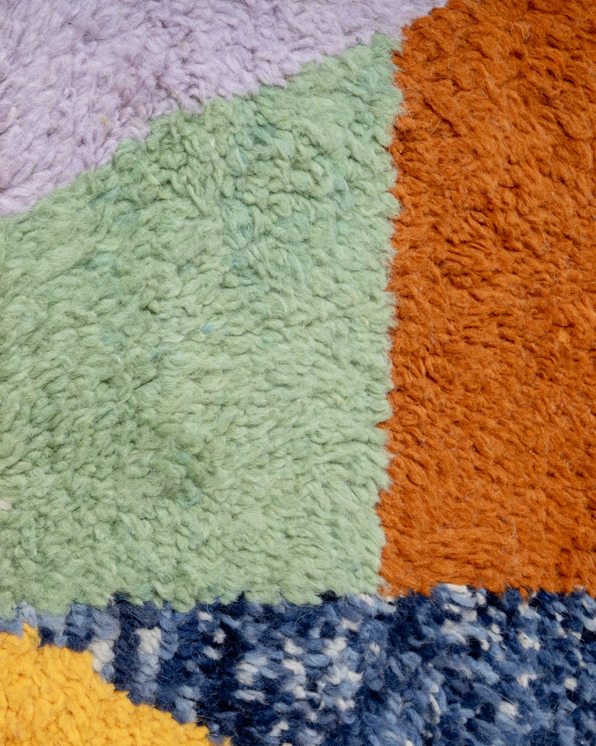 Modern, designer, handcrafted Berber rug from Morocco. Beniourain carpet with beautiful colours and patterns and fluffy wool texture.